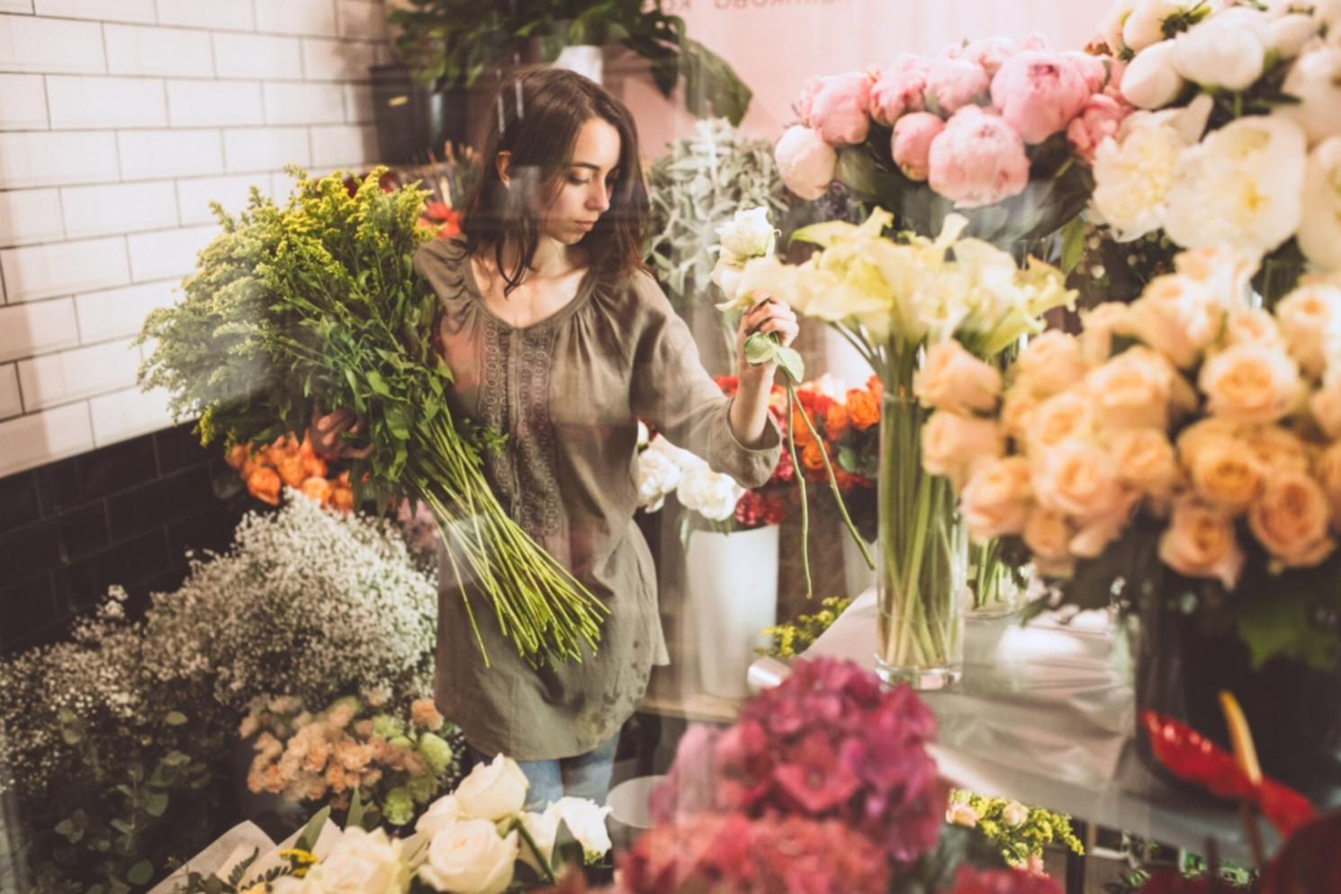 Elaborate wedding floral display featuring elegant centerpieces and ceremony arch decorations